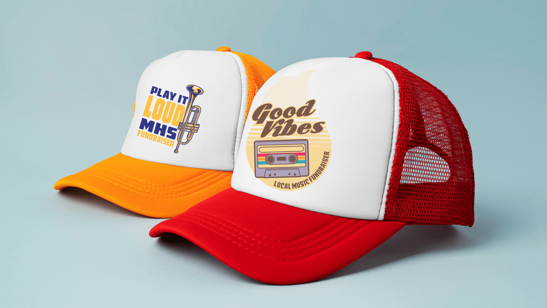 two custom trucker hats side by side, one orange with a band logo and one red with a music fundraising logo