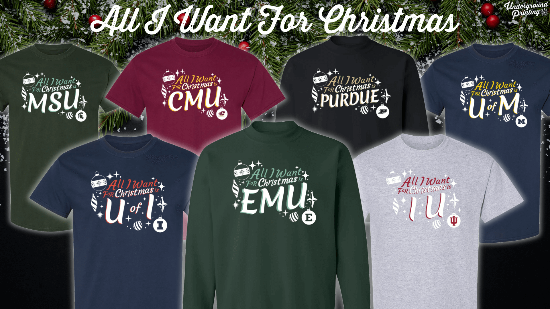 A holiday-themed assortment of "All I Want For Christmas" t-shirts, each representing a different university, including MSU, CMU, Purdue, U of M, EMU, and IU. Each shirt is decorated with festive icons and the respective school name.