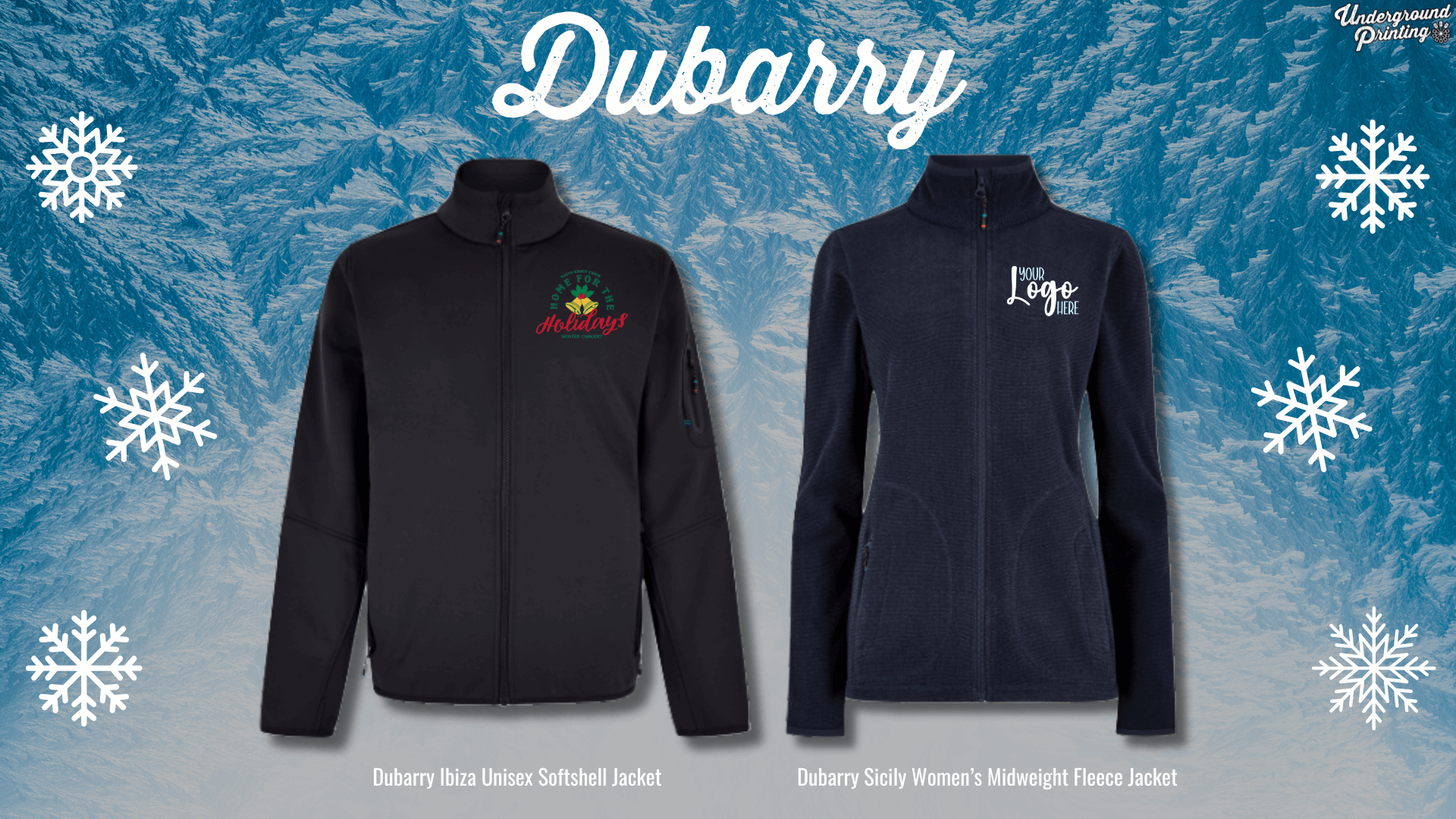 Two jackets from Dubarry on a snow-themed background. The left is a black "Dubarry Ibiza Unisex Softshell Jacket" with a festive holiday design. The right is a navy "Dubarry Sicily Women’s Midweight Fleece Jacket" with a custom logo area on the chest. Snowflake illustrations appear in the background.