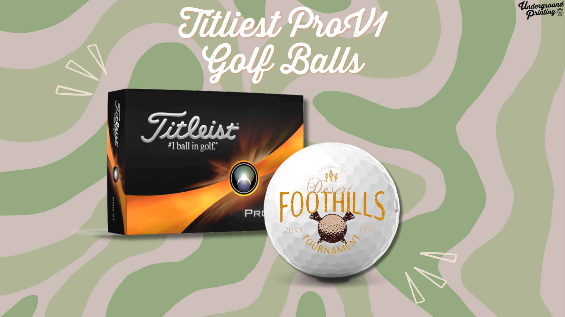 A box of Titleist ProV1 golf balls alongside a golf ball with a custom "Desert Foothills Tournament" logo. The set is displayed against a green and beige camouflage-style background with decorative lines.