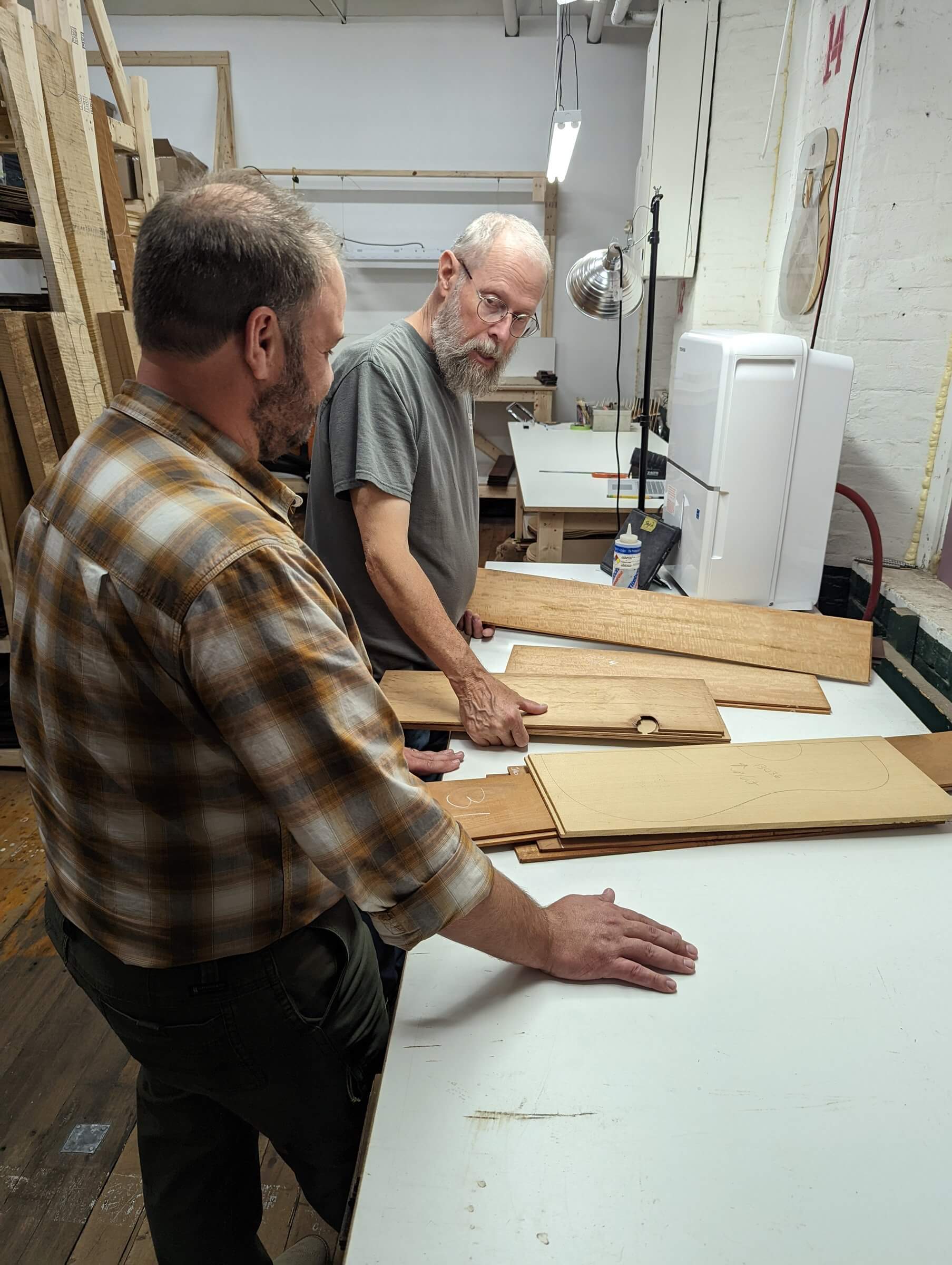 Dana Bourgeois and John Chapman, picking out wood for a Bourgeois Guitar