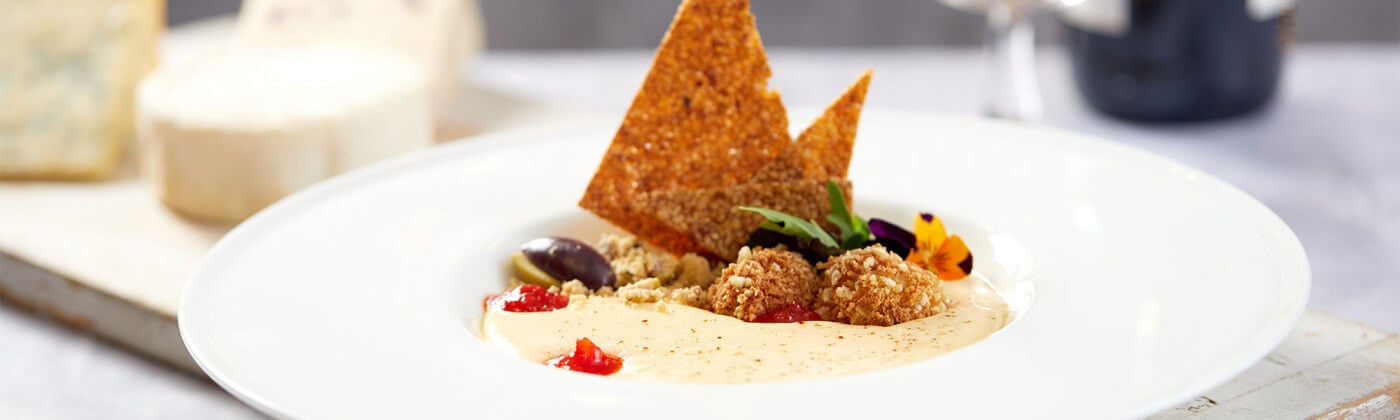 Goats cheese custard, olive and parmesan crumble with blue cheese and kimchi croquettes