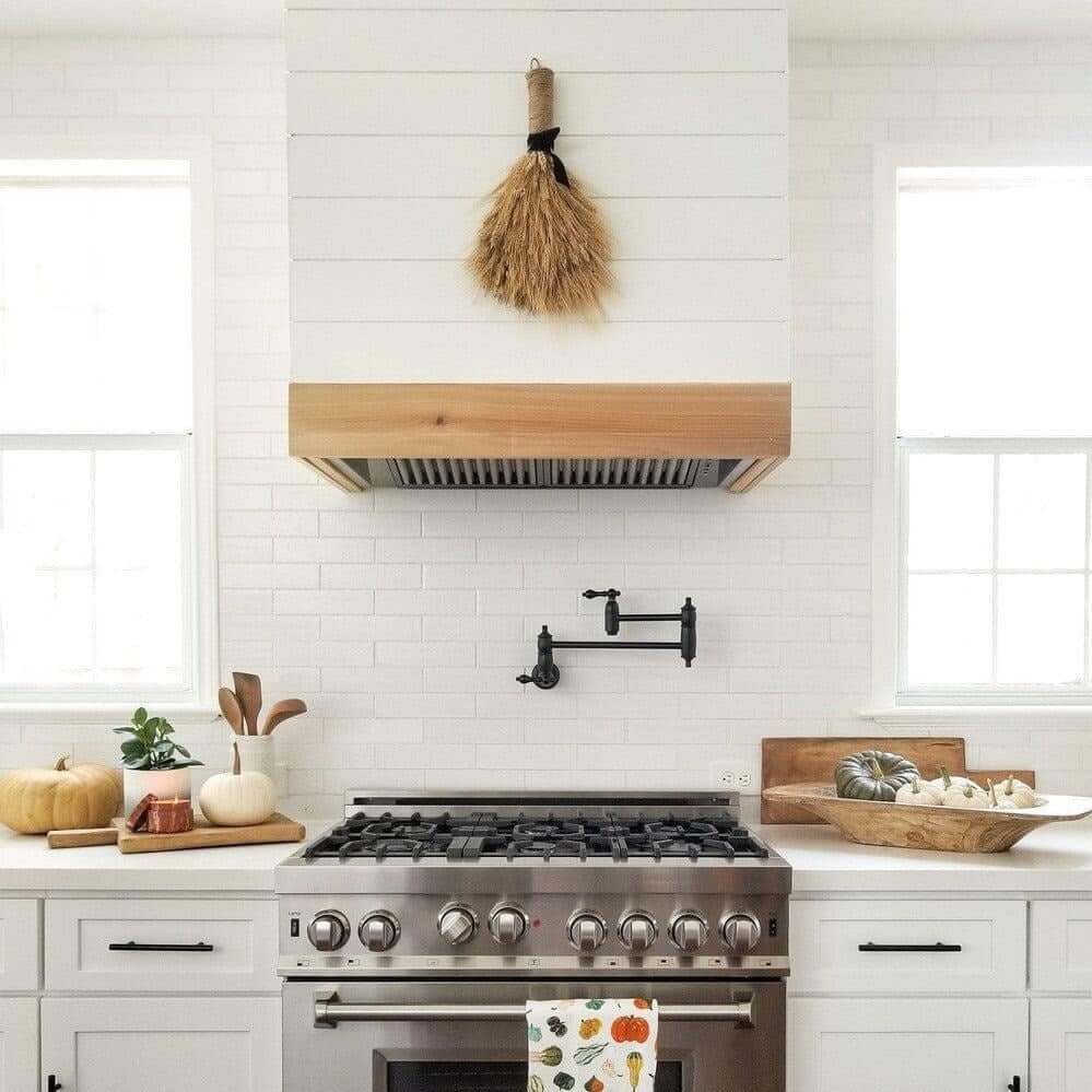 ZLINE range hood insert in a farmhouse-style kitchen