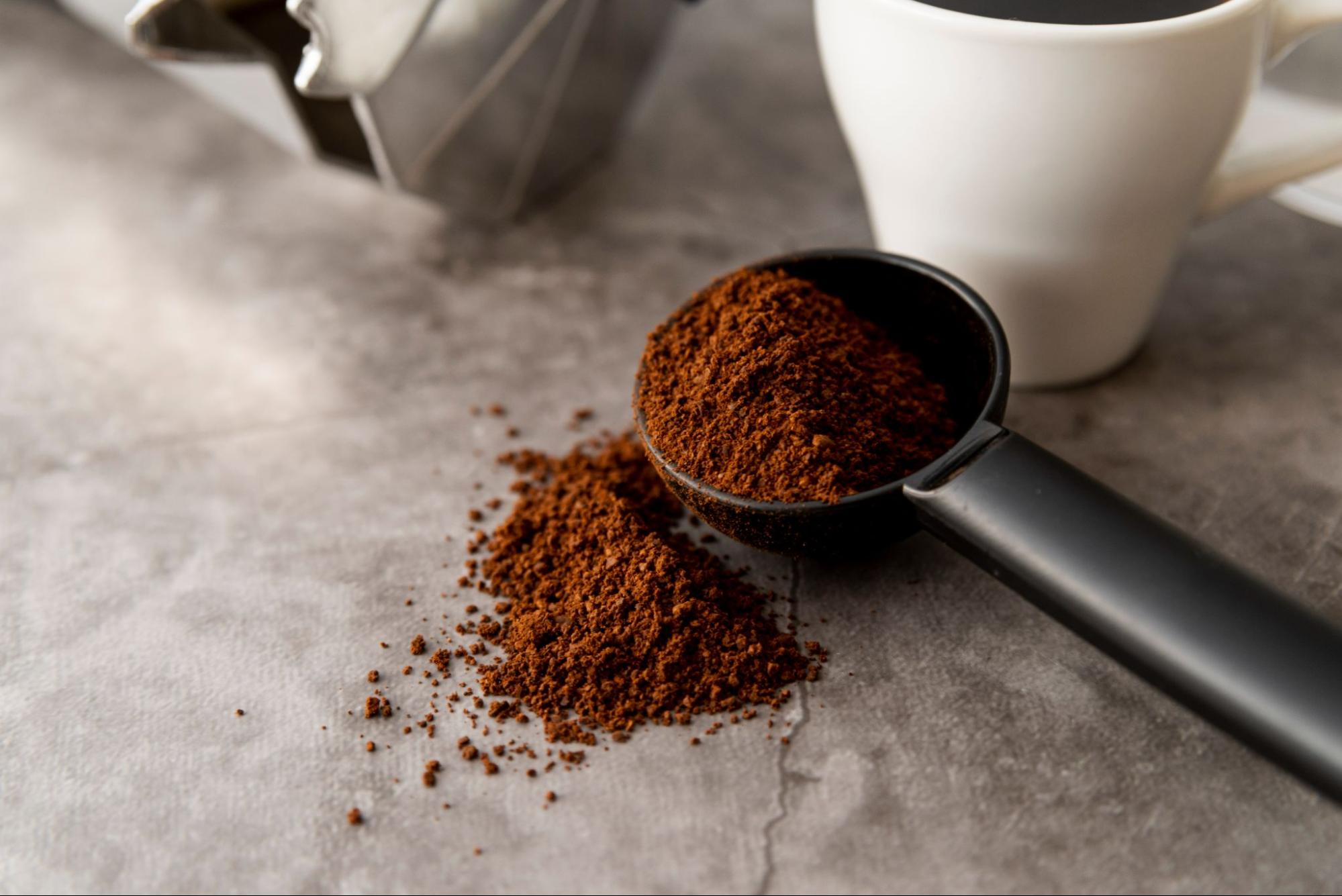 close-up of ground coffee powder in a spoon