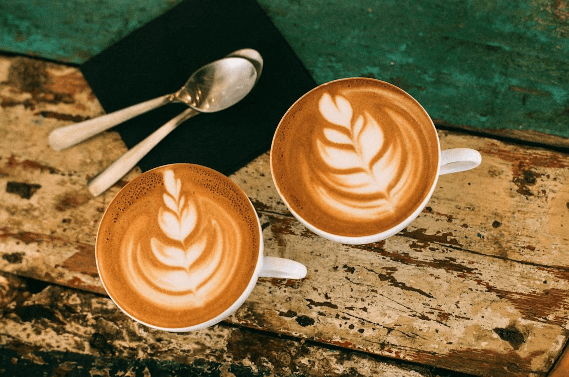 two coffees on wood table
