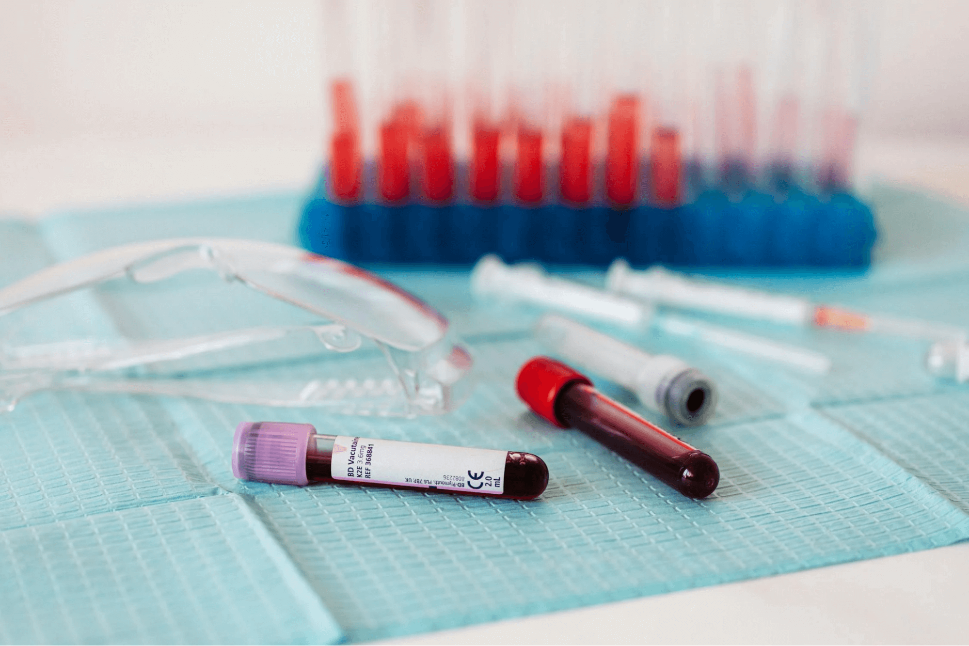 full vials of blood near medical equipment
