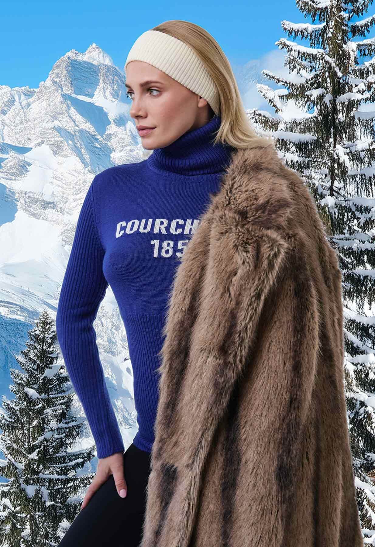 Lady in mountains wearing blue Linla KnitwearCourchevel jumper