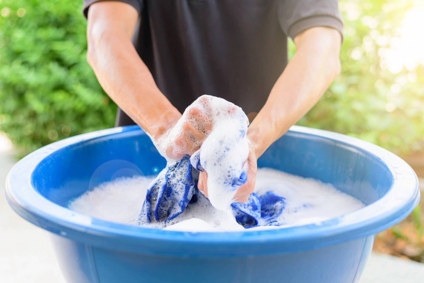 Hand Washing Laundry in a Bucket