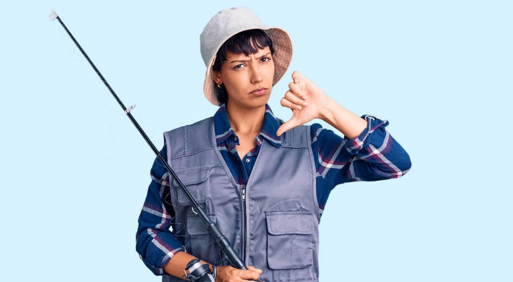 Angler woman doing a  thumbs down 