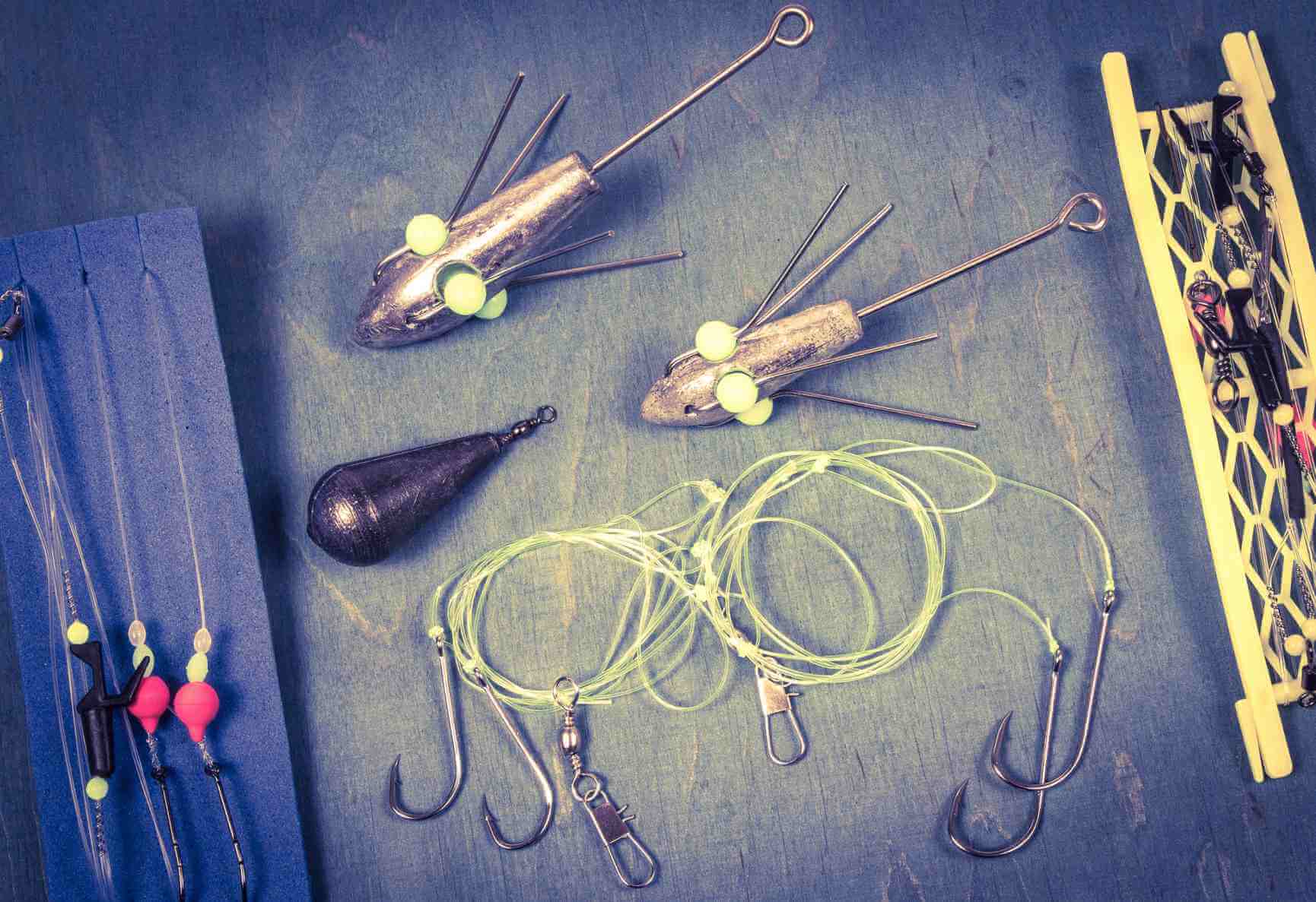 Hooks, sinkers, and leaders used for building a fish finder rig for saltwater fishing.
