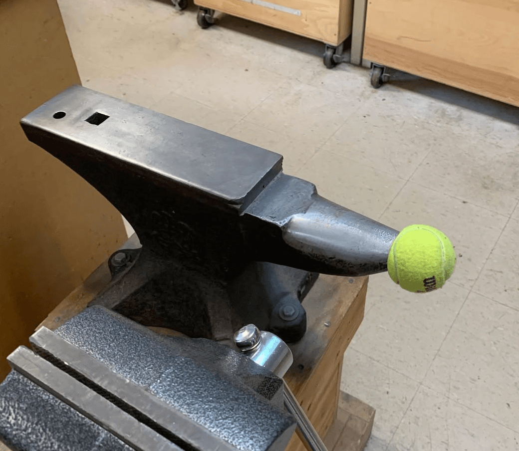 a jeweler's anvil with a tennis ball covering the pointy edge. essential safety tools + tips.