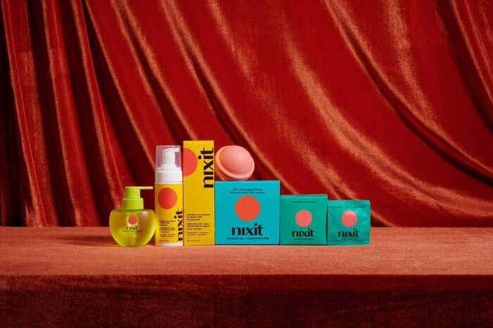 a nixit product bundle in front of a dark orange background