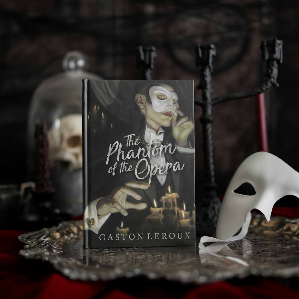 front cover of The Phantom of the Opera LitJoy Classic; the masked Opera Ghost surrounded by candles