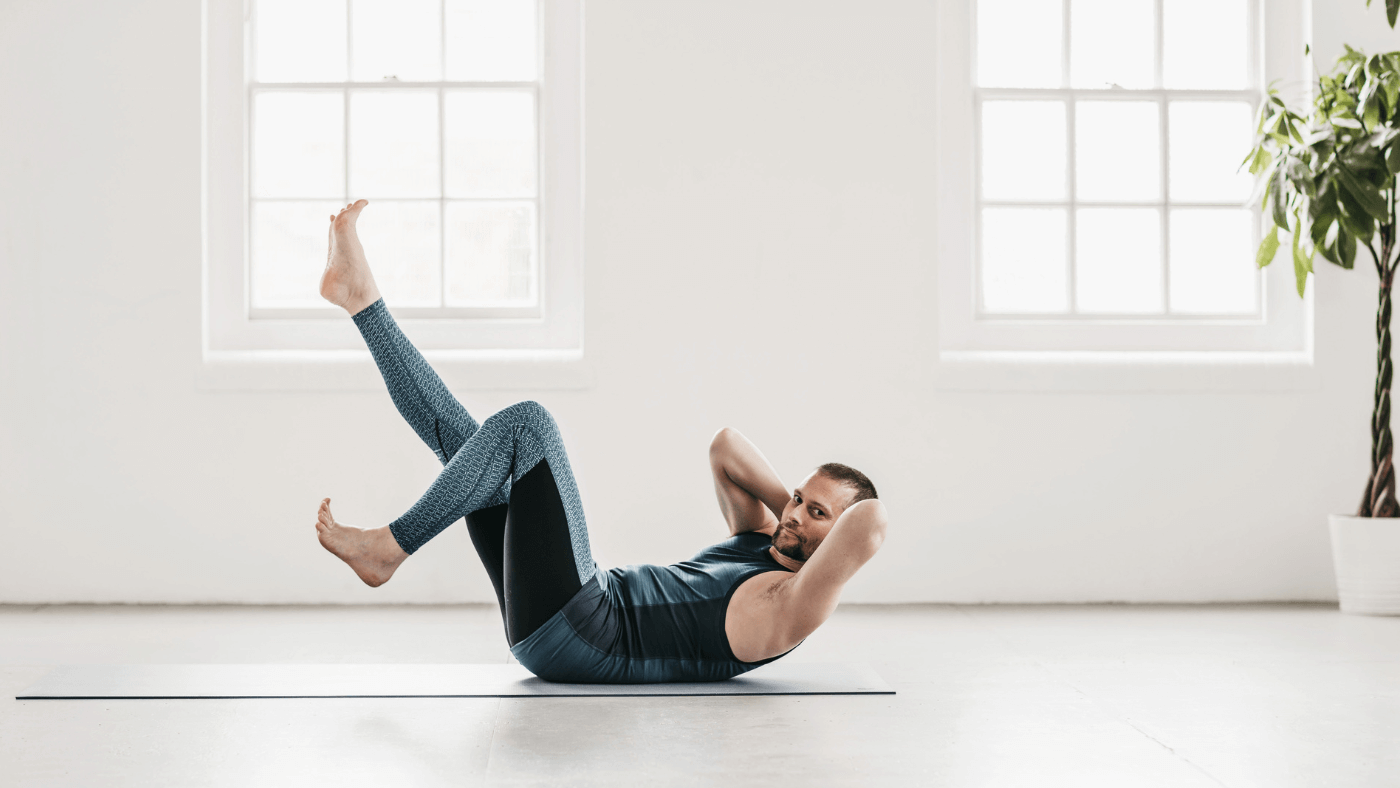 Forrest Yoga teacher, Craig Norris doing core work