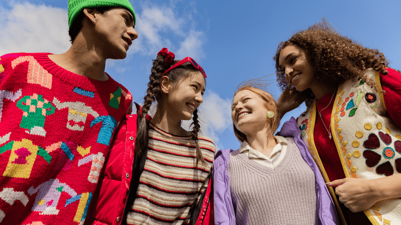 4 people in colourful knitwear