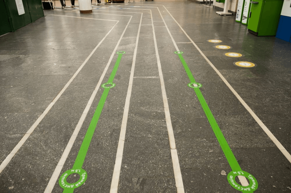 white and green floor tapes installed in a facility