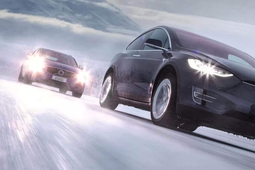 Two SUVs on Nokian tires driving on an icy surface