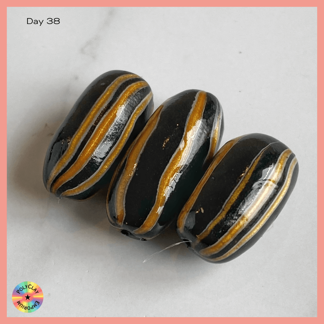 Polymer Clay Black beads with gold stripes