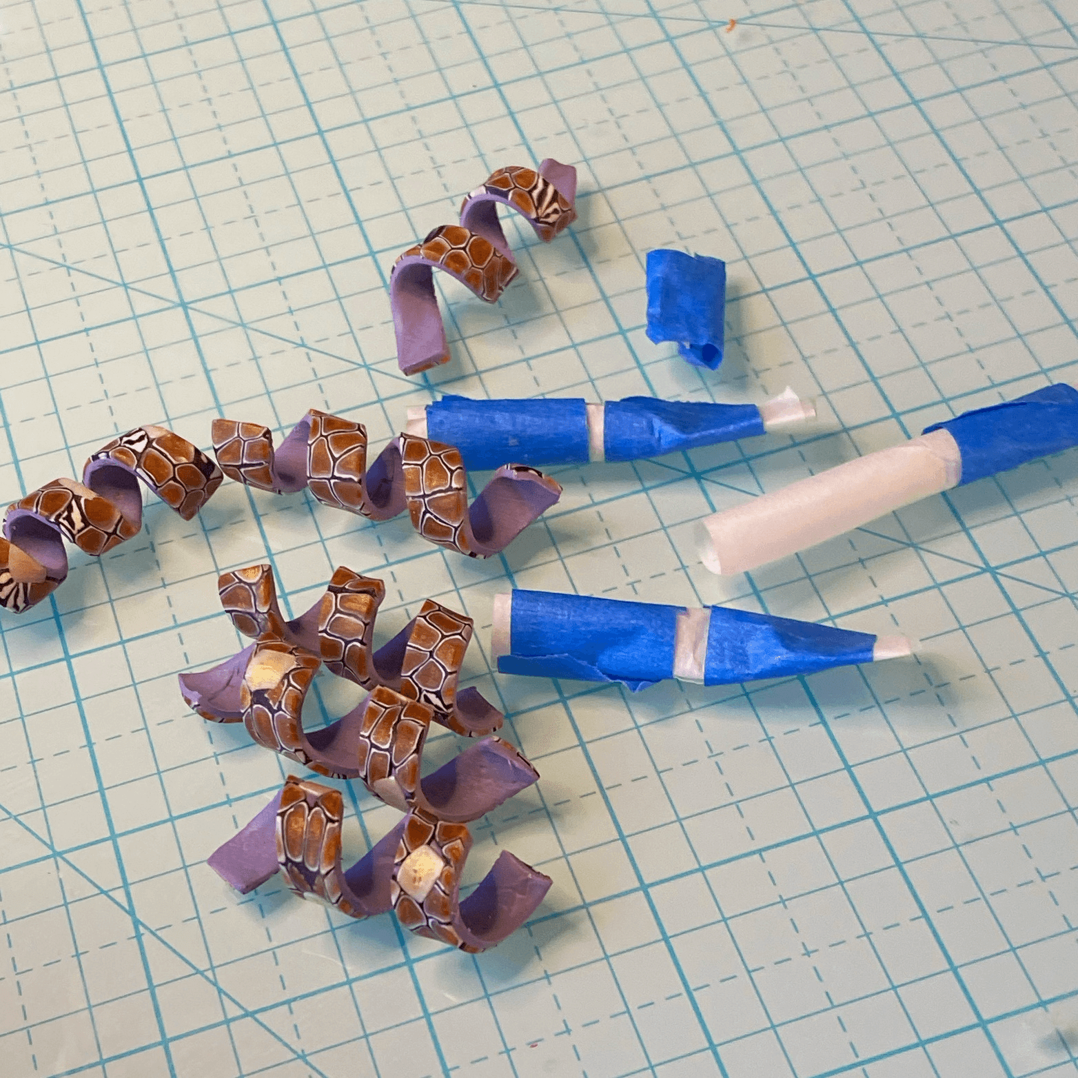 The polymer clay spirals baked and the paper/tape bases removed