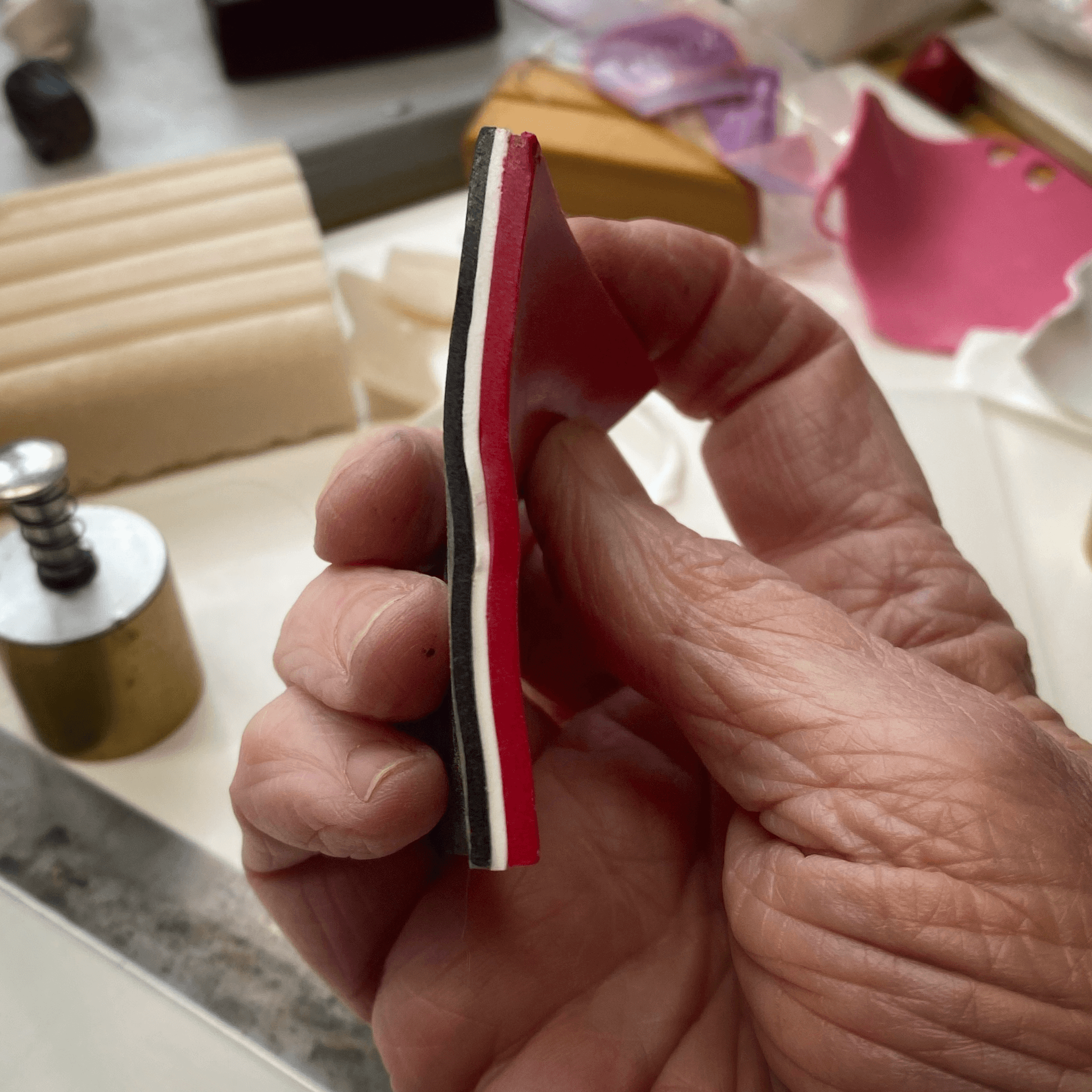 Red, White and Black layers of polymer clay