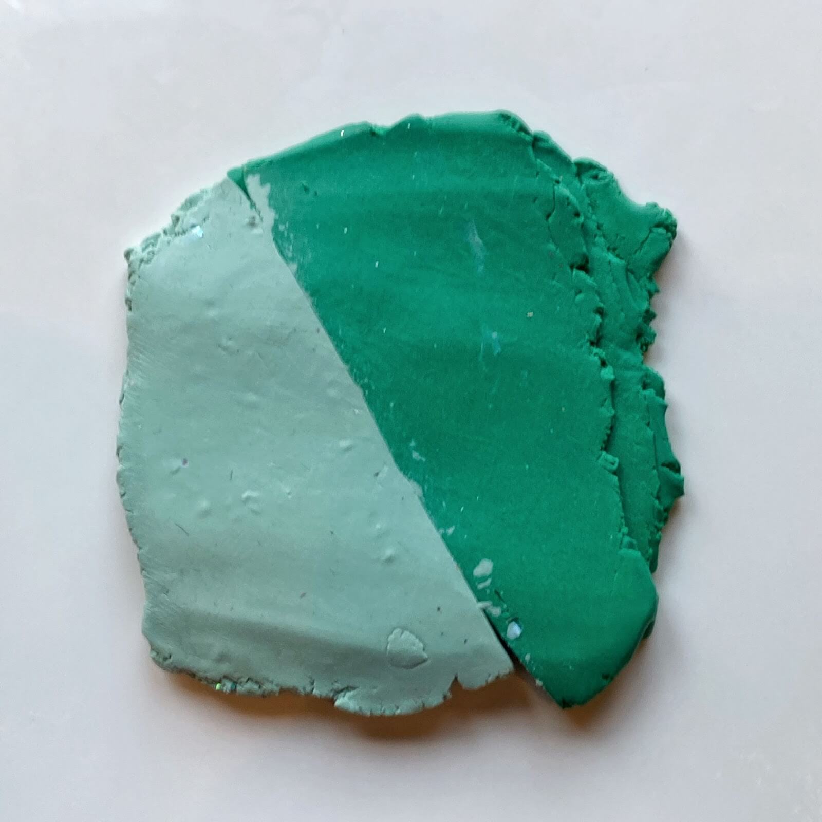 The two polymer clay greens laid out to make a skinner blend.