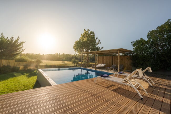 Photo of a villa with pool in Spain with girl sleeping on inflatable