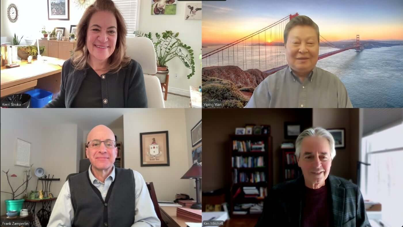 Screenshot of four people in zoom meeting smiling