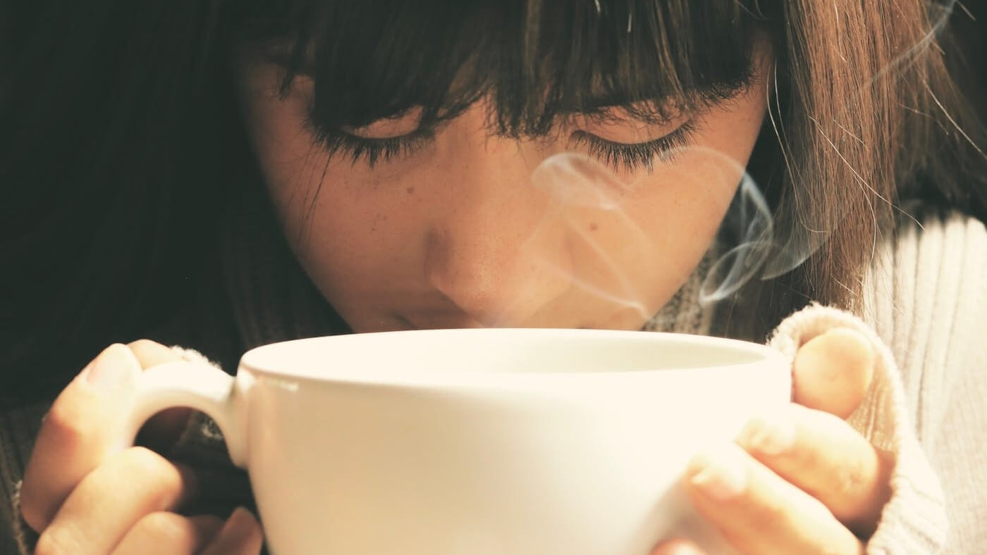 Girl Savors Hot Water Lemon Tea