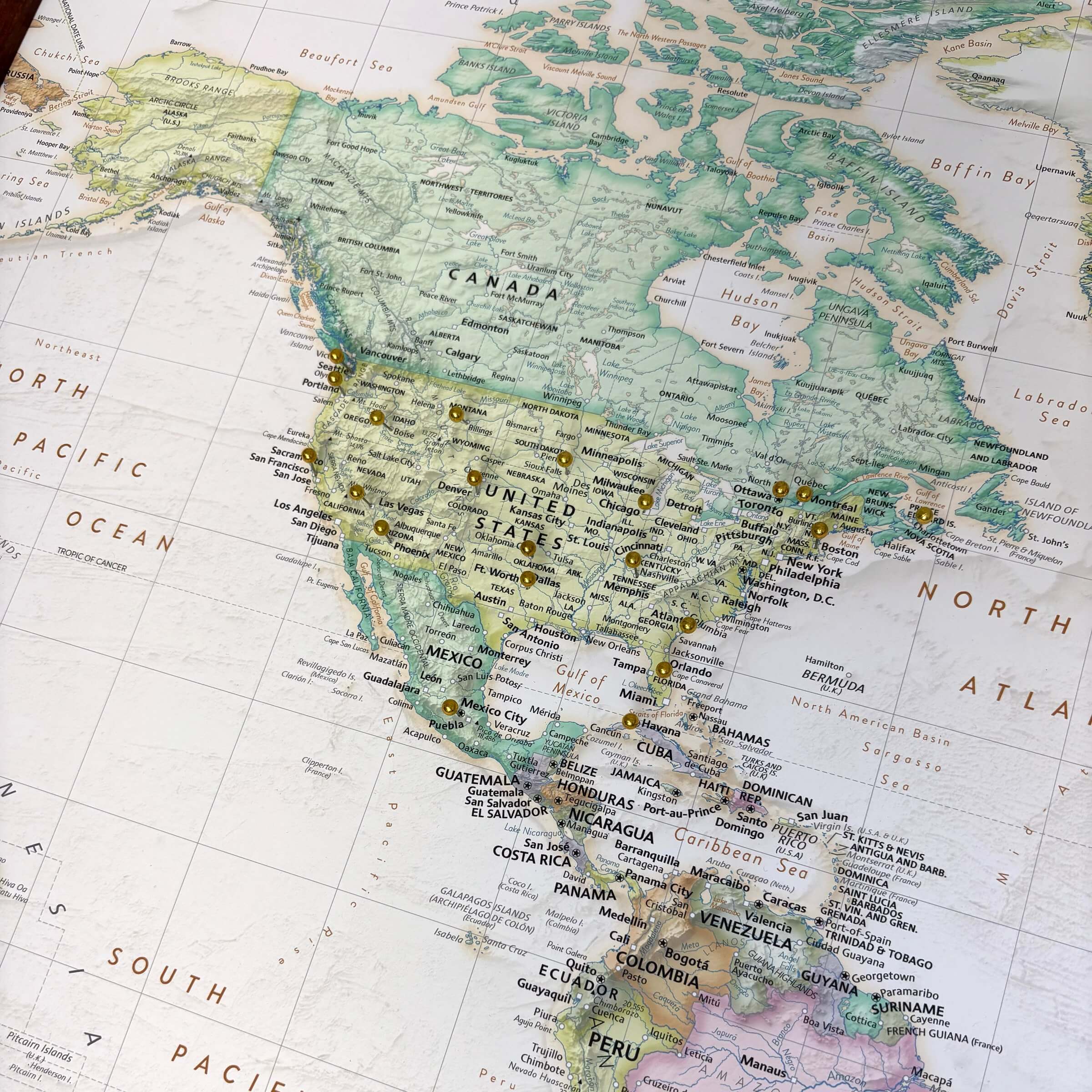 Detailed push pin map of the world. Image is focused on the United States with several decorative pins inserted