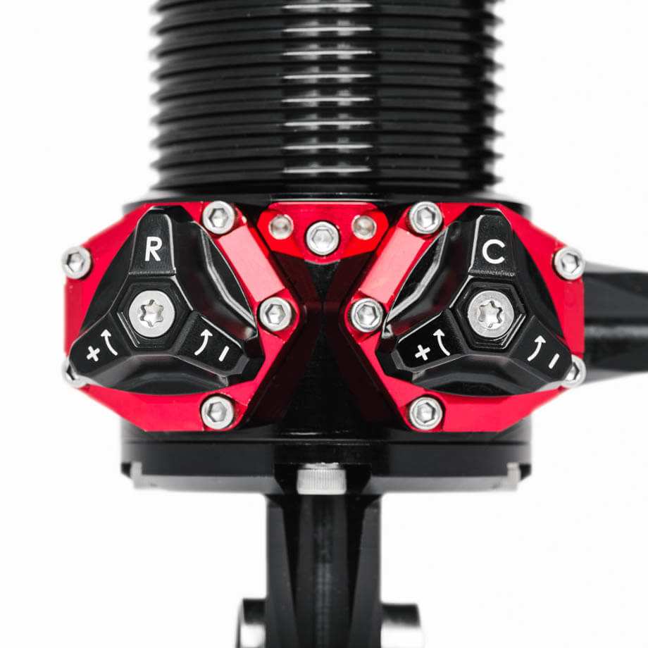 A close-up of the MOD Series shock’s 24-click adjustment knobs, providing precise tuning for drag racing setups.