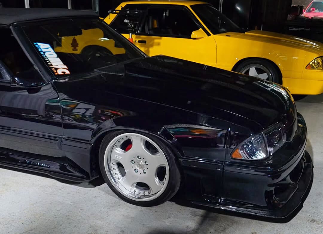 A detailed view of the rare OZ wheels with an ET19 offset, perfectly tucked under the Fox body’s fenders.