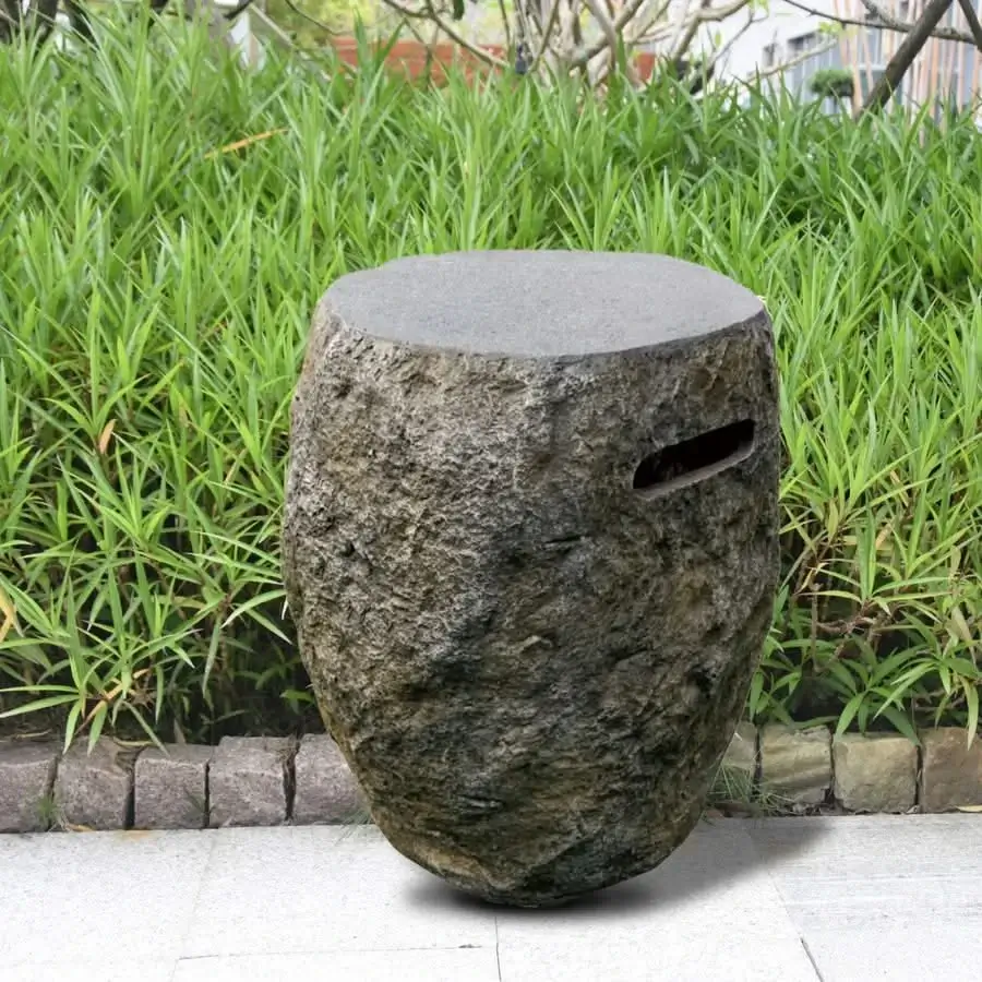 concrete decorative propane tank cover in front of grass