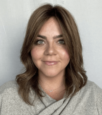 Woman wearing a hair topper to cover her thinning crown