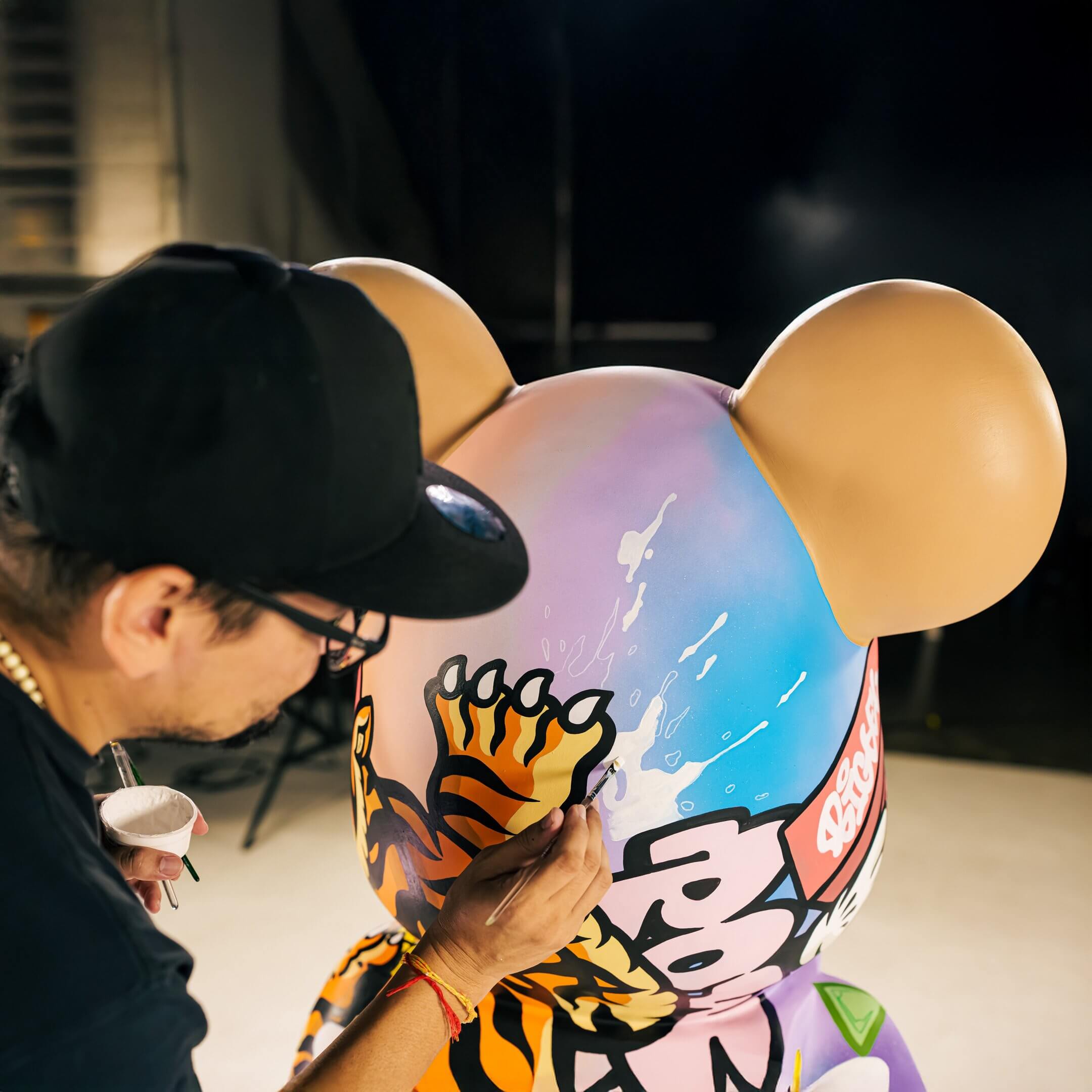 In a striking fusion of color and design, BigDel emerges from abstract gradients with sharp outlines and fluid motion.