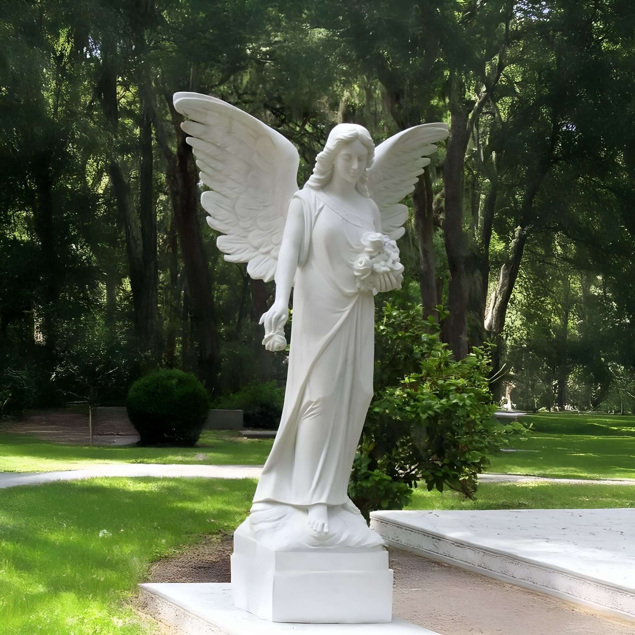 White angel statue holding flowers in lush garden