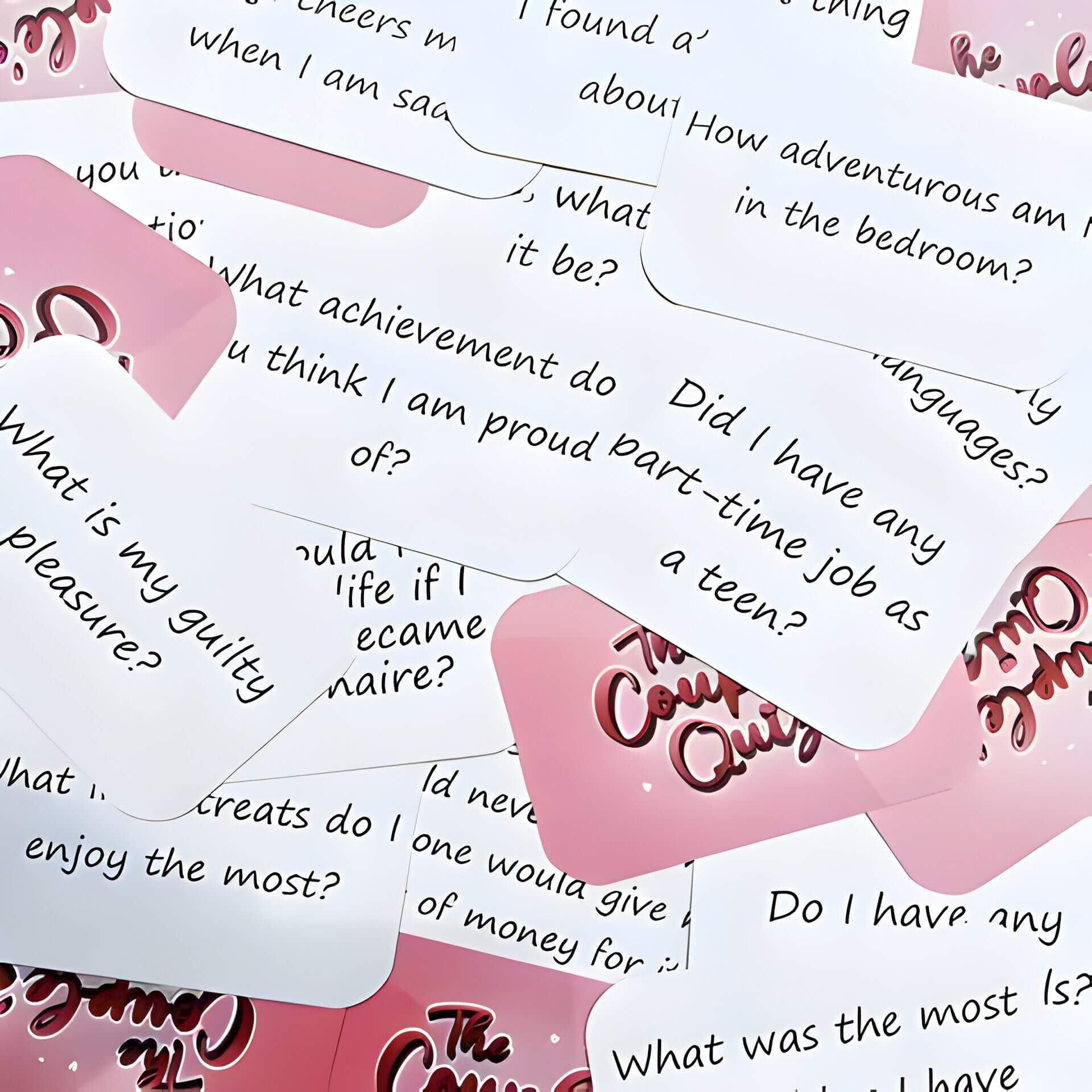 Pink and white questions cards from a game
