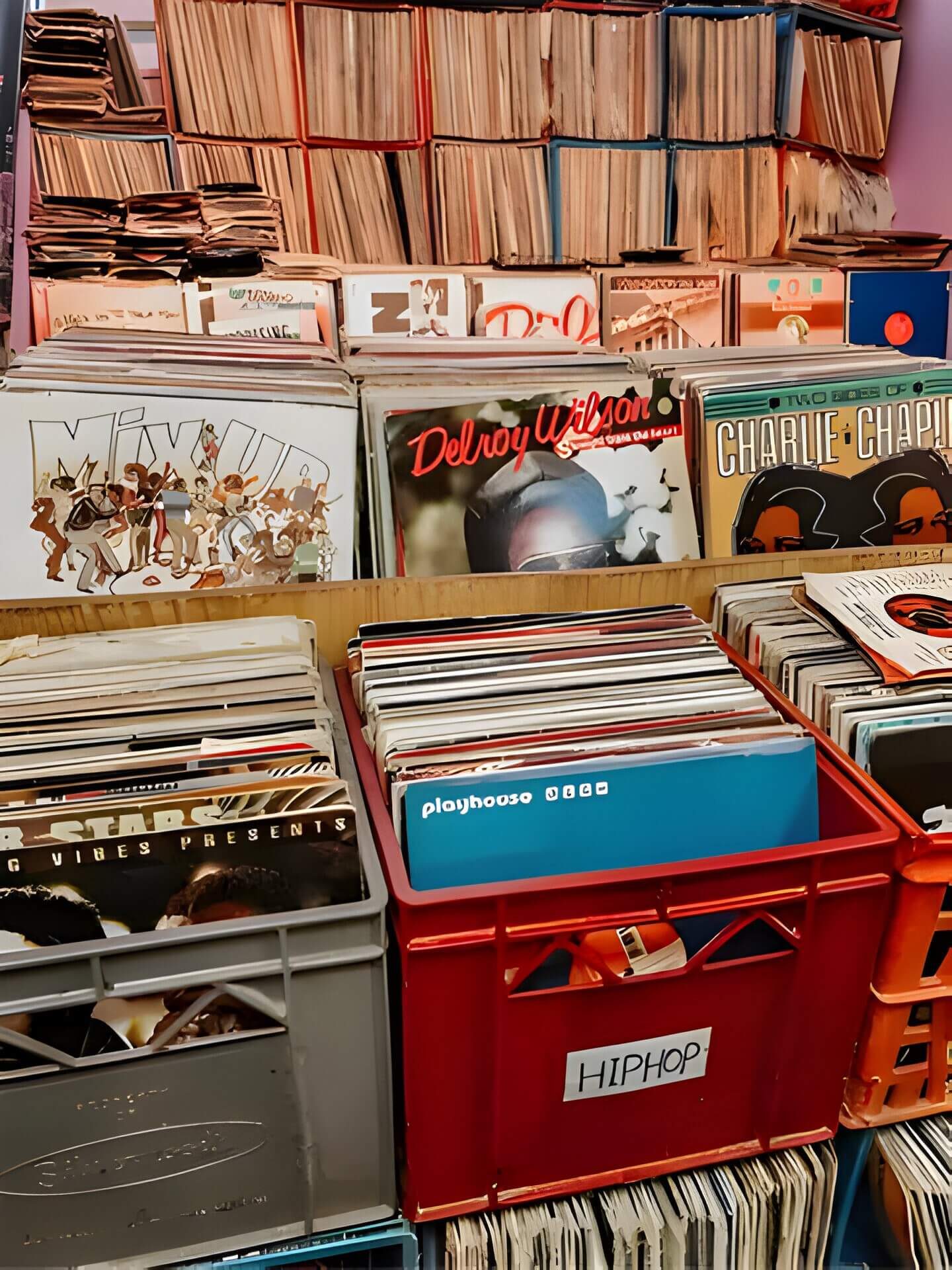 a photo inside a record store, showing boxes of full records