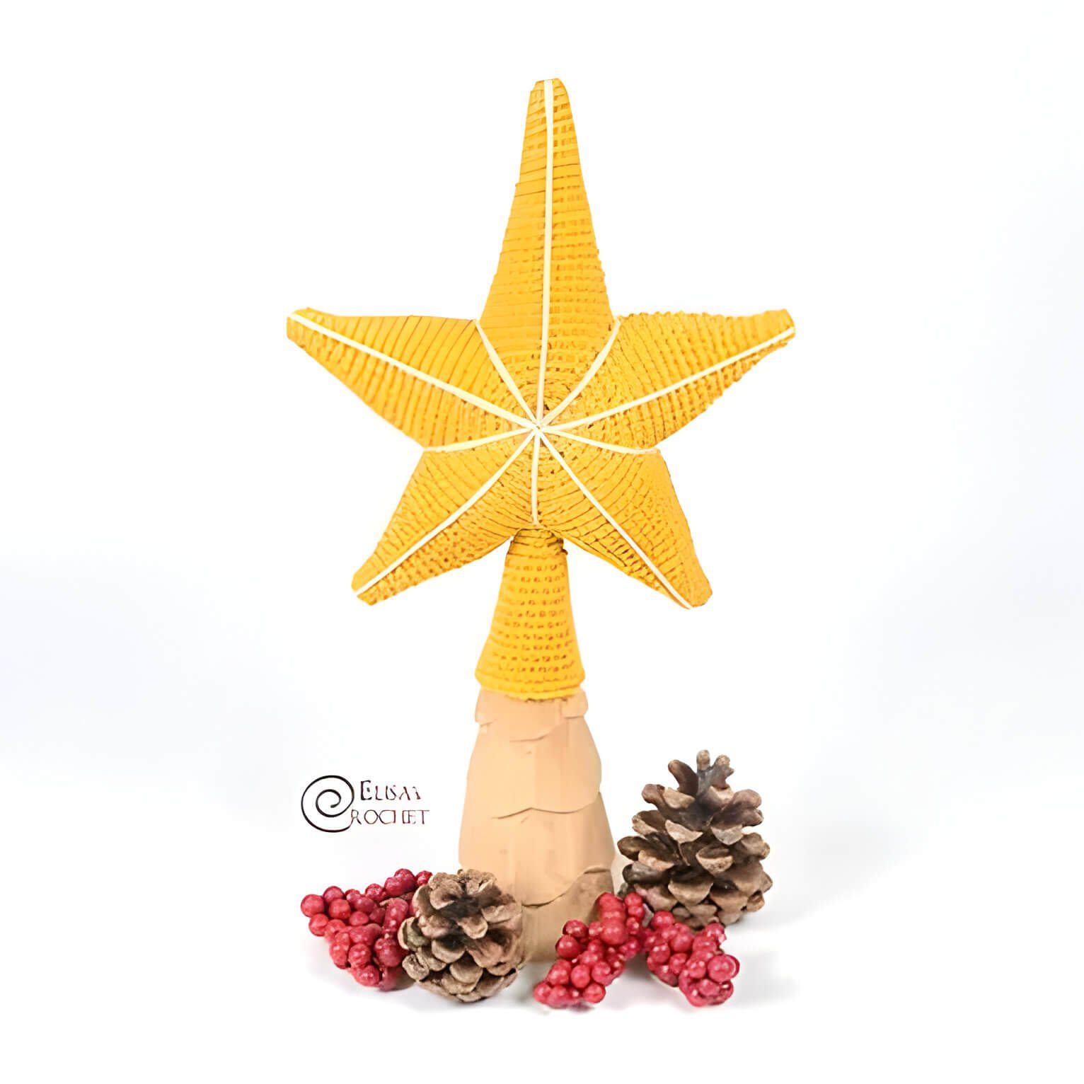 a yellow crochet star tree topper