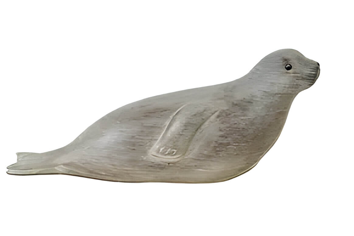 a wooden sculpture of a seal