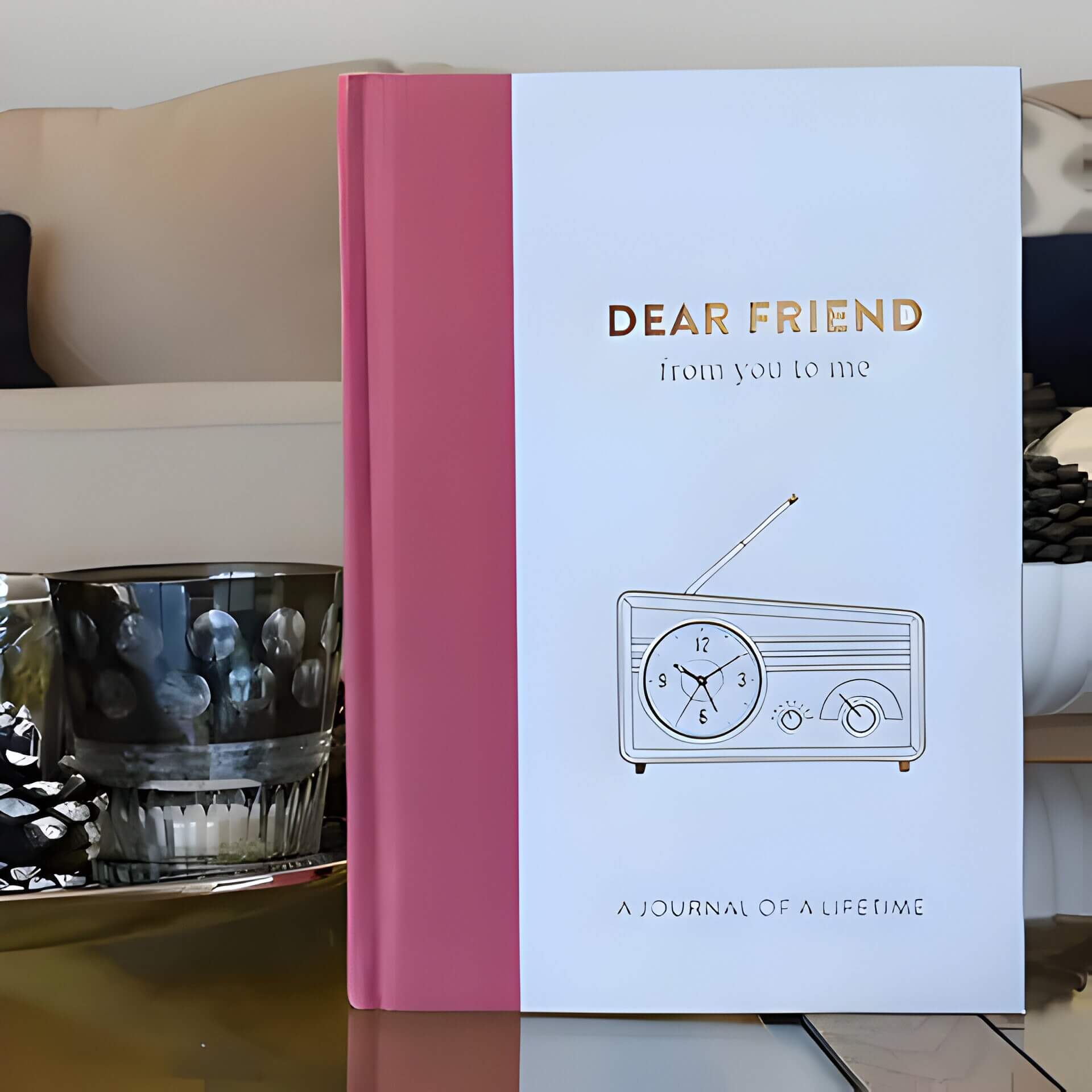 a white and pink friend journal book