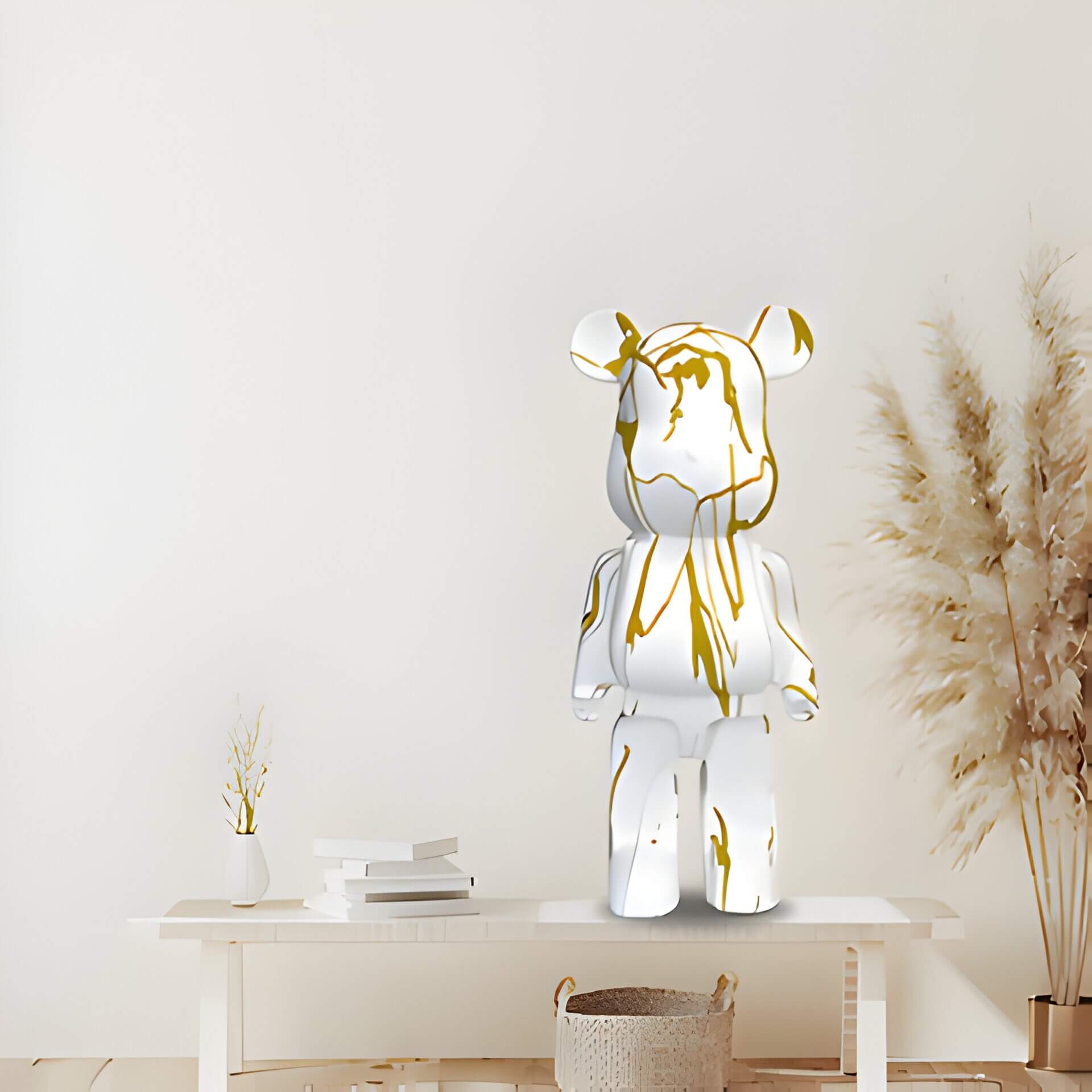 white and gold giant bear sculpture in a neutral background
