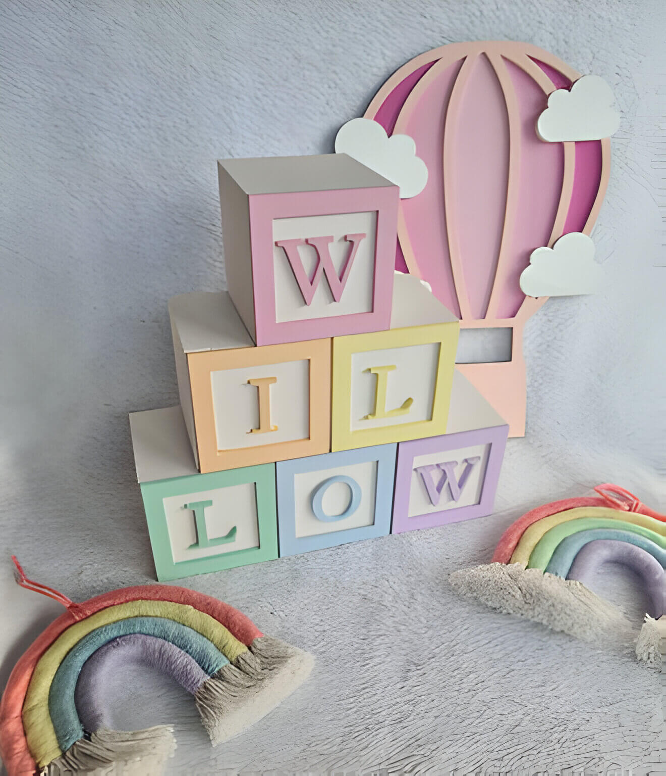 Pastel multicoloured baby blocks spelling out 'Willow'