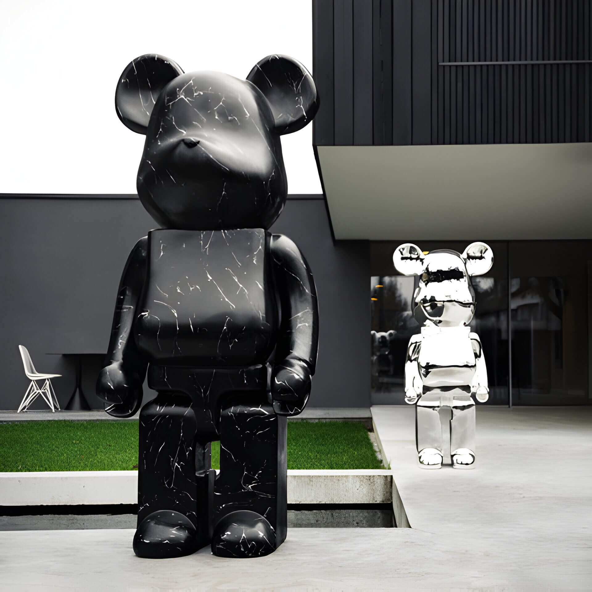 Giant Bears 165cm sculpture and chrome 135cm bear sculpture next to luxury modern home garden