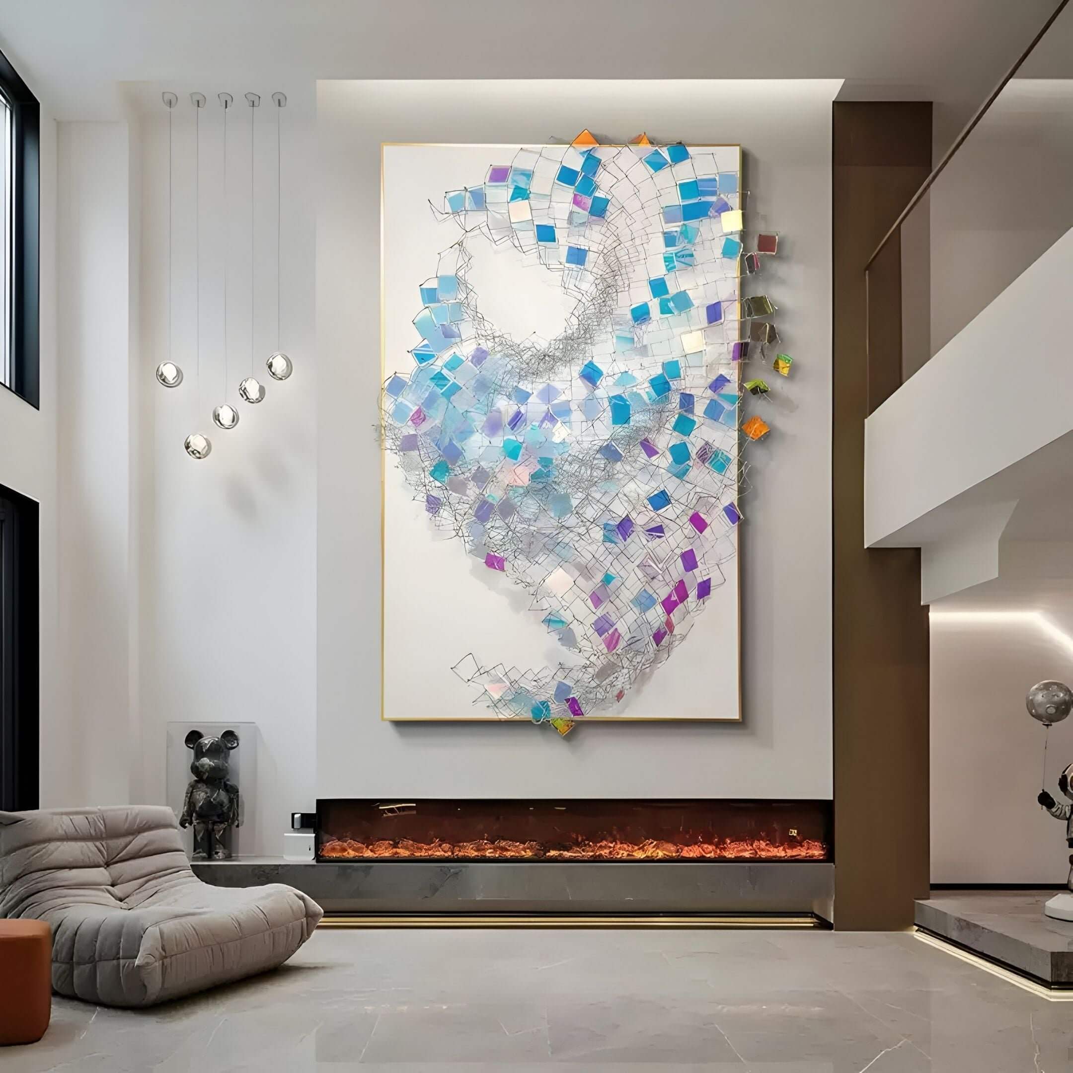 A contemporary living room with large acrylic and metal mesh wall art featuring iridescent blue and purple geometric panels above a modern fireplace, surrounded by minimalist furniture and sculptural accents.