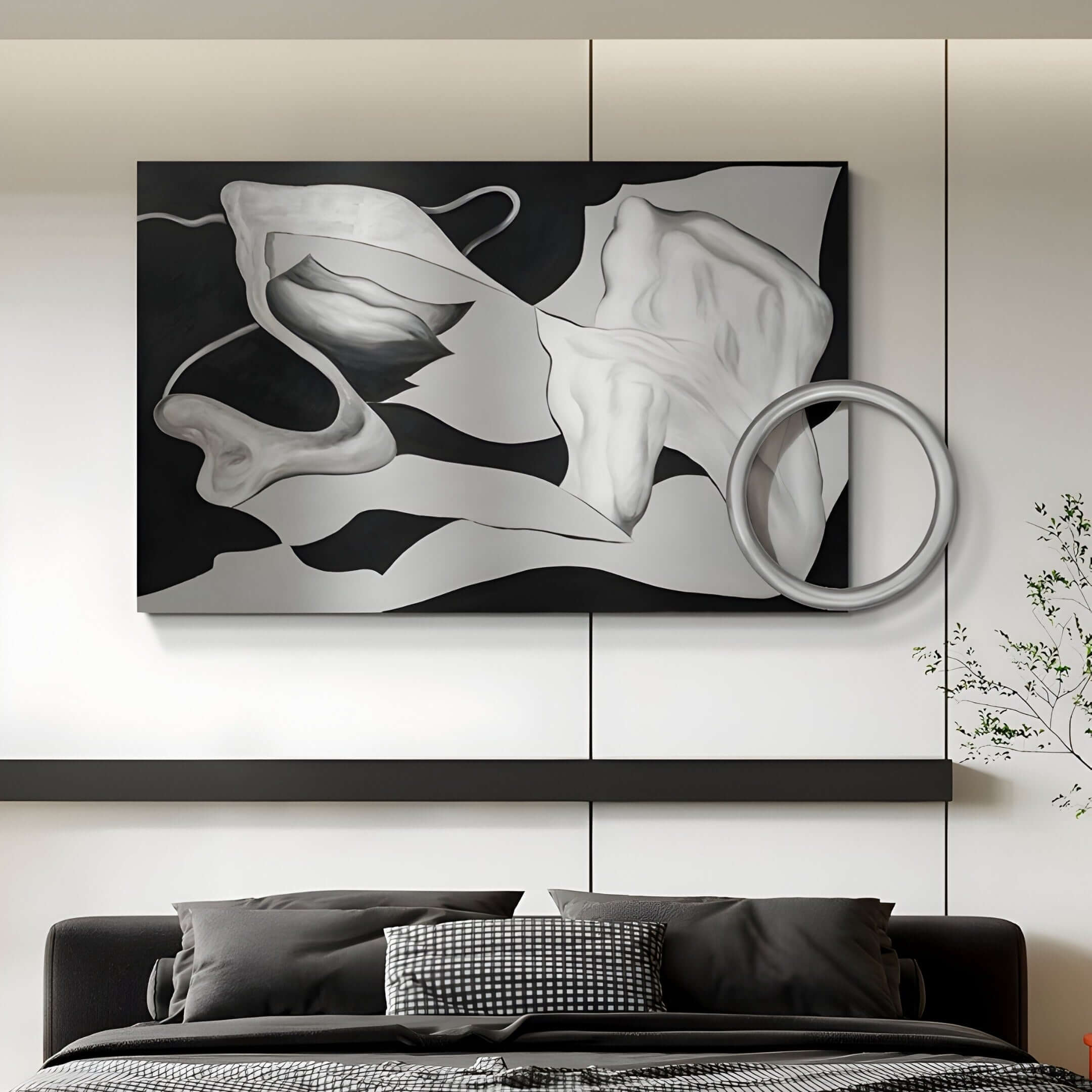 Black and white surrealist wall art with sculptural circular detail above a monochrome modern bed.