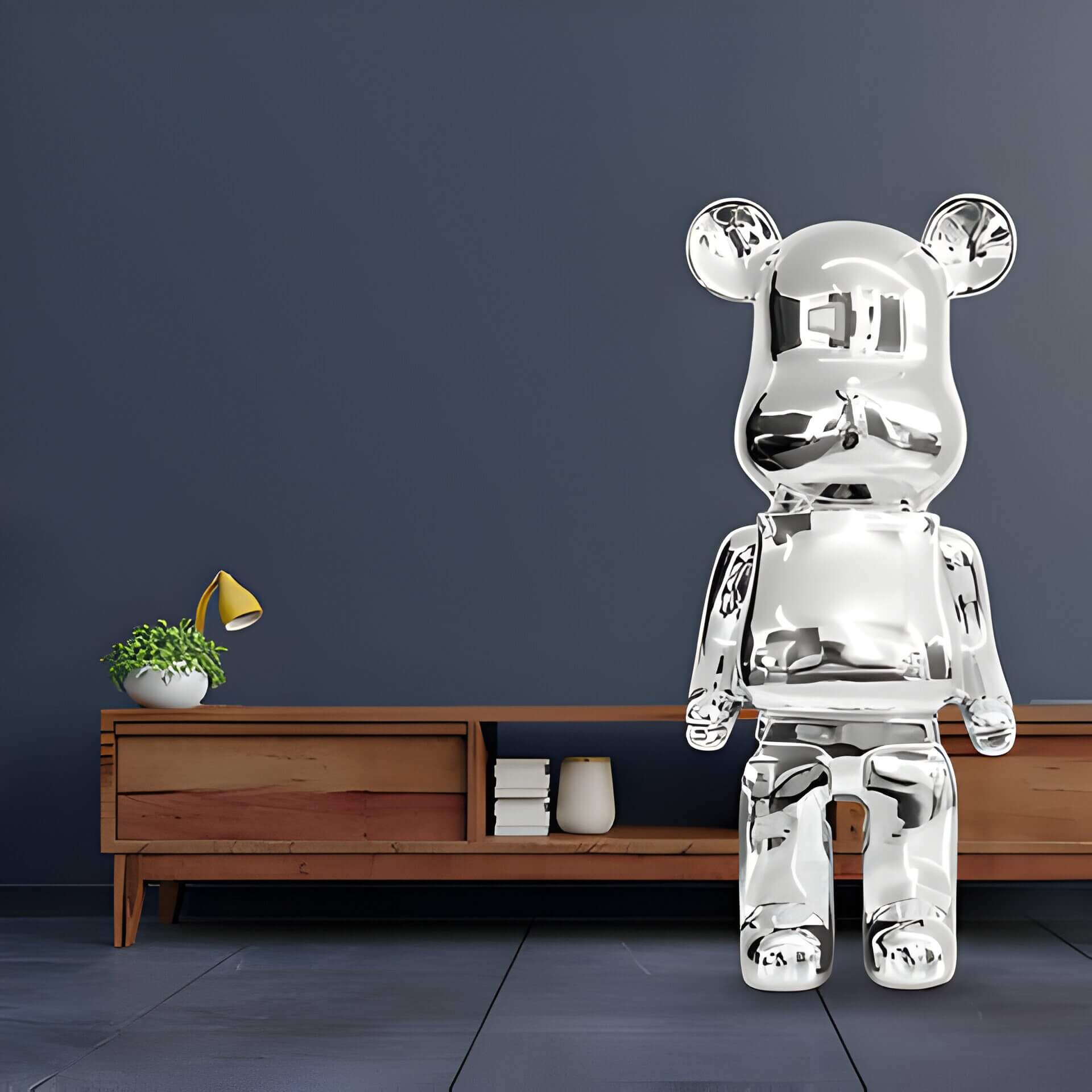 A Chrome Giant Bear sculpture against a dark blue wall