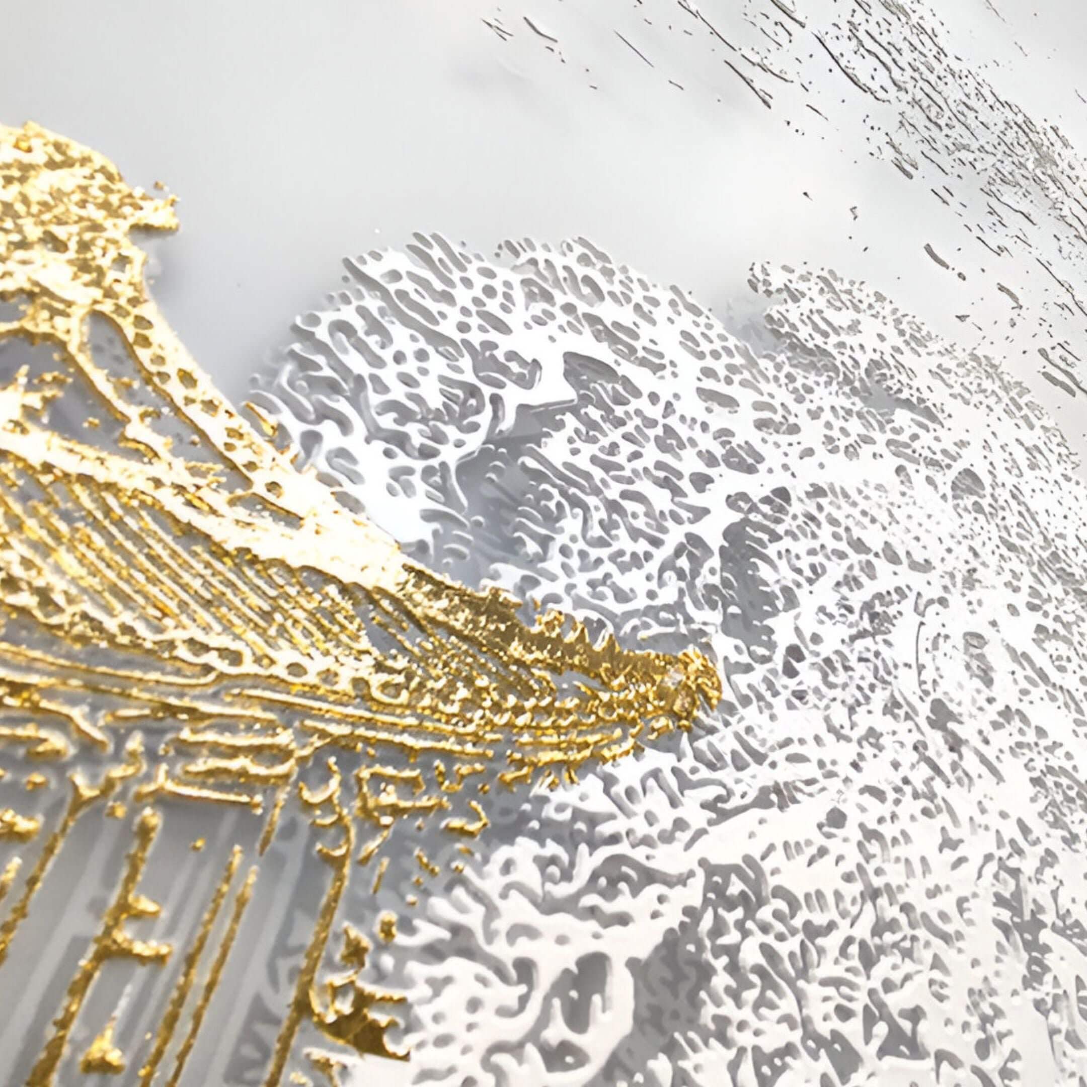 Close-up of abstract silk art with gold accents and detailed white raised textures