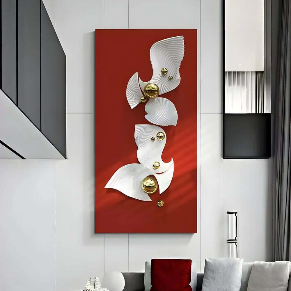 Vertical red wall art panel with flowing white sculptural shapes and small gold spheres mounted in a modern living room with tall white walls and grey curtains.