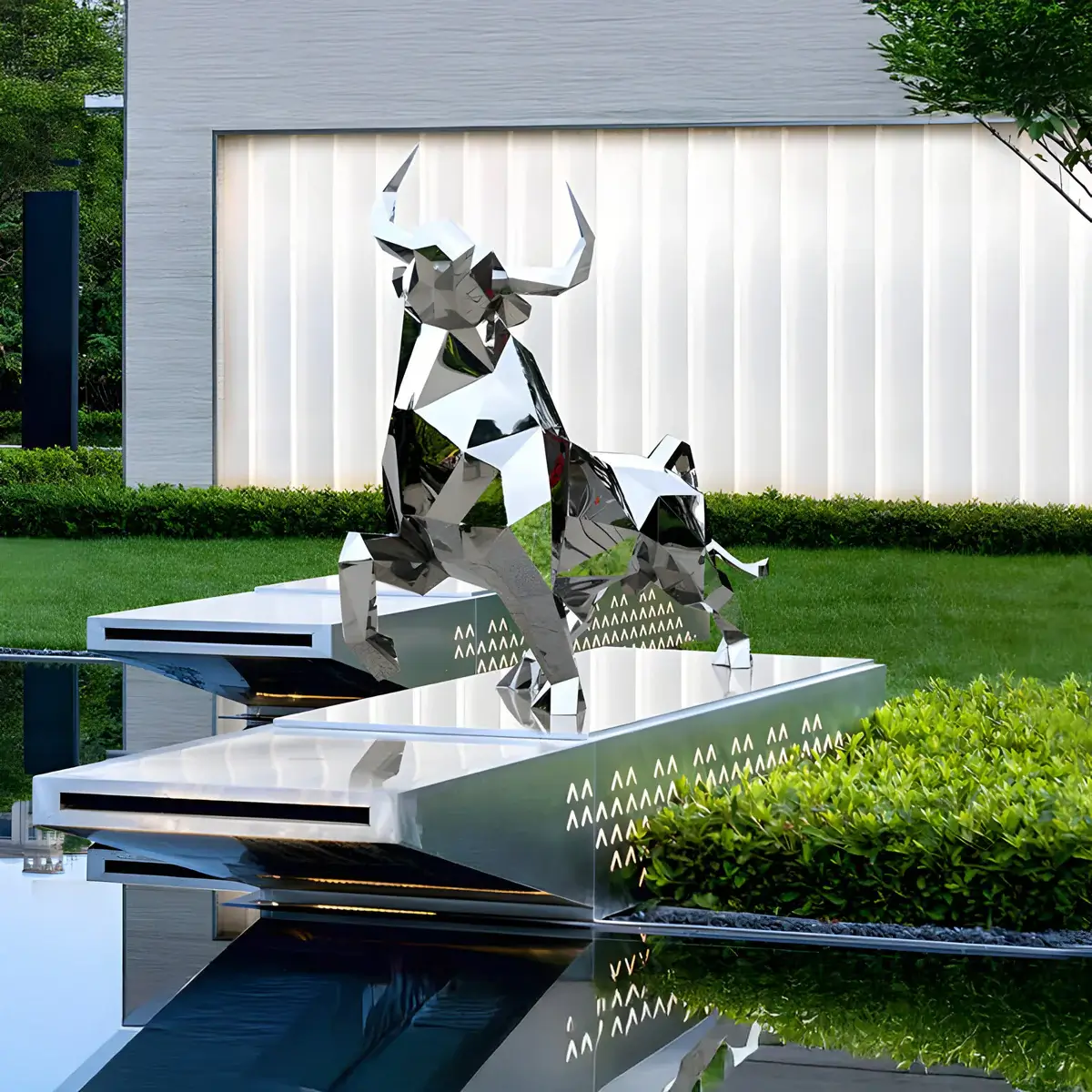 A modern, polygonal metal bull sculpture displayed on a sleek, mirrored water platform.