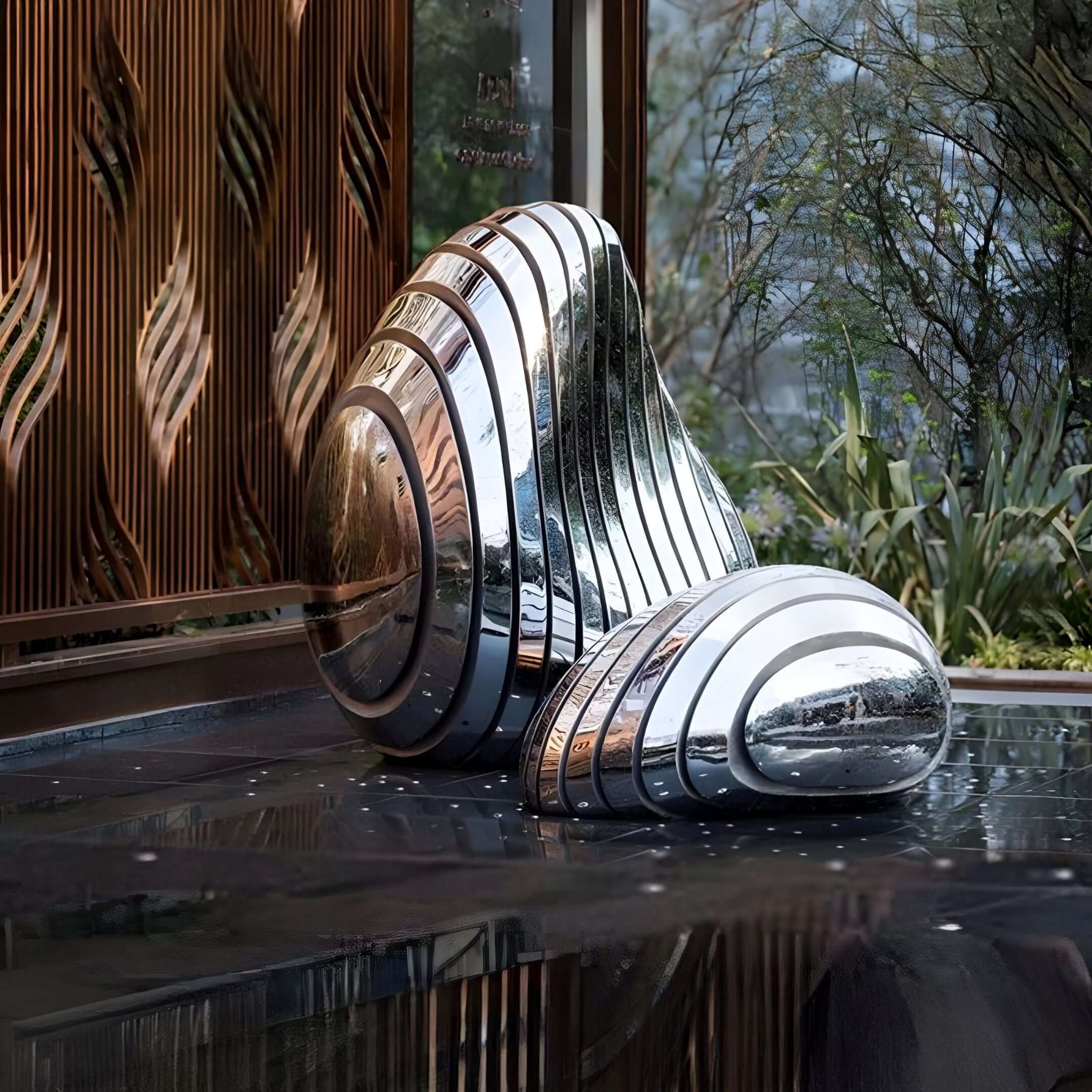 Abstract Chrome Sculpture – A polished metallic sculpture with curved layers, displayed in a modern space with water reflections.